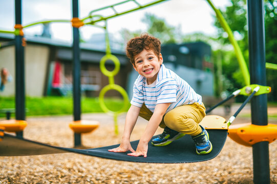 Happy kid on playground on summer season
