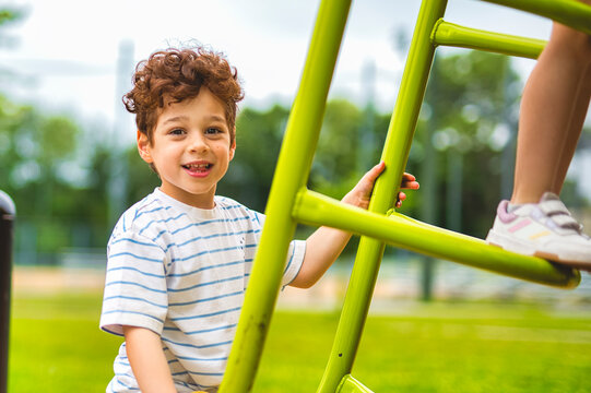 Happy kid on playground on summer season
