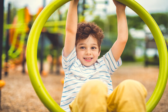 Happy kid on playground on summer season
