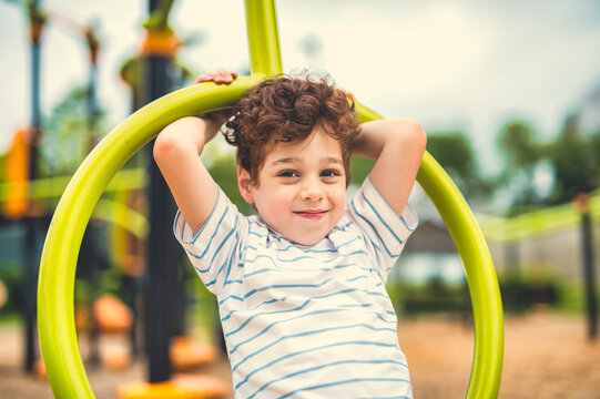 Happy kid on playground on summer season