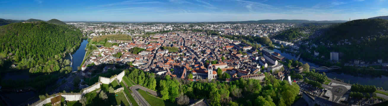 Aerial view of the Besancon Citadel overlooking the historic city center nestled within the Doubs river loop and surrounded by green hills in Besancon, Bourgogne-Franche-Comte, France.