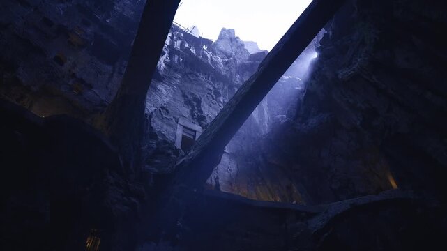 Blue lit cavern with crossing bridges and shaft light, damp limestone walls, mosscovered stone, deep shadow pockets, cinematic mist and echoing silence ideal