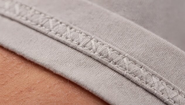 Closeup medium shot of underwear flatlock seams stitched with contrast thread highlighting durability and style while ensuring comfort against skin.