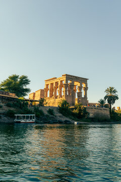 Philae Temple reflected on the Nile River in Aswan Egypt