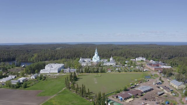 Rising up aerial shot of Valaam Monastery on sunny summer day. Ladoga lake, Karelia, Russia.