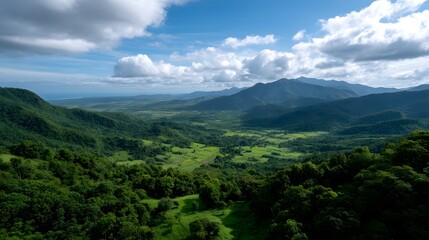 Obraz premium An expansive view of rolling green valleys and fields under a dramatic cloudy sky