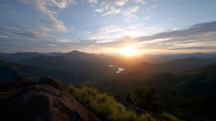 Obraz premium Vast mountain landscape viewed through soft colorful clouds at sunrise or sunset