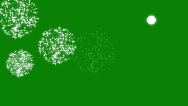 Magical glittering fireworks with sparkling star particles on green screen background loop motion graphic video element for chroma key compositing editing and visual overlay effects.