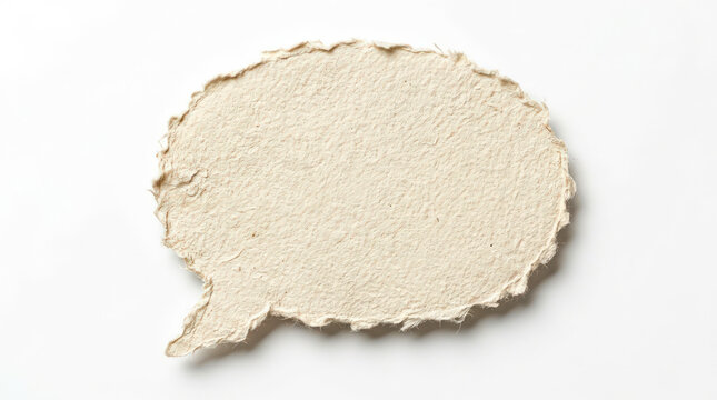 Blank speech bubble cutout from textured handmade paper on white background