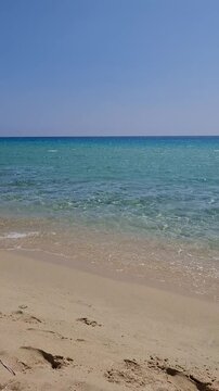 Relaxing sunny day at Spiaggia Solanas featuring clear blue water and white sand in Sardinia