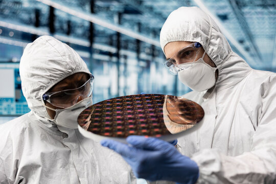 Looking at semiconductor substrates, photolithography analysis and close up of qc engineers in smart factory. Evaluating microchip silicon wafer prototype, teamwork and industry 4.0 plant colleagues