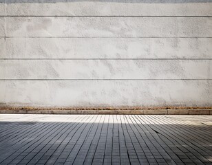 Fototapeta premium city street with long concrete wall covered in white plaster featuring copy space and mockup