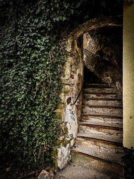 Ivy-covered historic stone staircase leading to Saint James Church in Boskovice