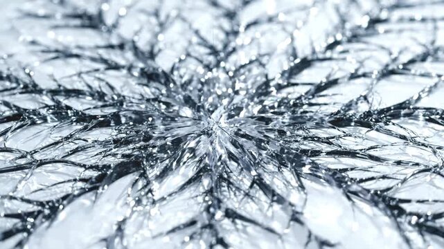 Macro close-up of dark crystalline fracture pattern spreading across white icy surface