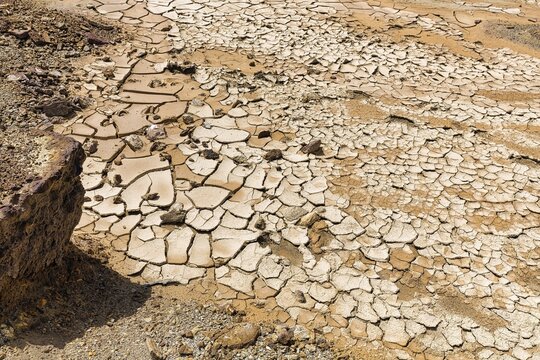 Parched soil, dry cracks after flooding, drought, climate change, Andalusia, Spain