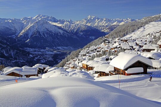 View of the village overlooking the Rhone valley with deep snowfall, in the back Dom 4545m, Matterhorn 4478m and Weisshorn 4505m, Bettmeralp, Aletsch area, Upper Valais, Valais, Switzerland