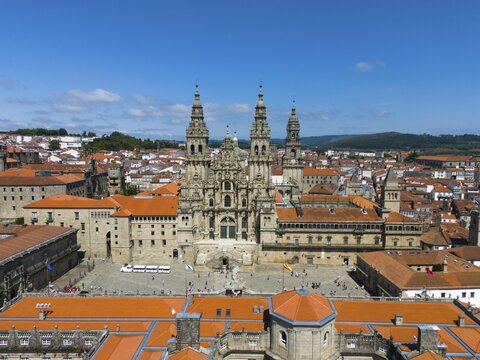 An impressive aerial view of a historic cathedral with red roofs on a sunny day, Cathedral, Santiago de Compostela, autonomous community of Galicia, place of pilgrimage, destination of the Way of St James, Spain