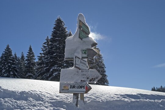 Guideposts ito the cross-country ski run in the Valepp valley near Spitzingess lake Spitzing Upper Bavaria Germany