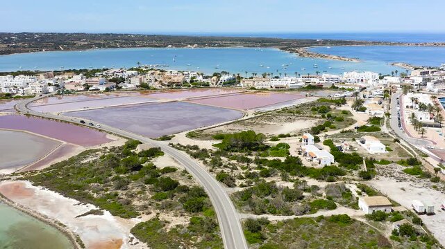 Aerial view of Estany des Peix lagoon and La Savina coastline in Formentera island, Spain.