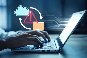 Obraz premium A person typing on a laptop keyboard surrounded by cloud computing icons and warning alerts, emphasizing the importance of digital security in a tech-driven world. Gantry
