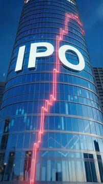 Vertical video of a modern glass skyscraper with white IPO letters. Glowing red rising market chart on the building facade. Corporate financial growth concept