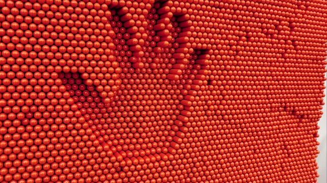Handprints on large red pin art toys.