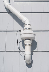 Fototapeta na wymiar radon mitigation installed system outside the house