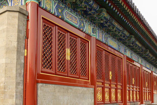View of the ornate red lattice windows and colorful painted eaves of the Forbidden City imperial palace Beijing, Beijing, China.