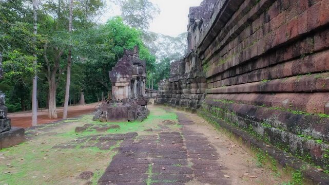 Ancient stone ruins of Thommanon Temple, Siem Reap, Cambodia. The intricate carvings and weathered stone showcase the historical significance of this Khmer Empire architectural marvel.