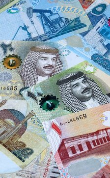 Bahraini dinar money bills in pile on table. Bahrain BHD currency cash close up
