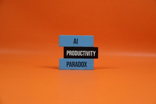 AI Productivity Paradox Concept With Stacked Blocks On Orange Background Representing Automation And Efficiency Dilemma