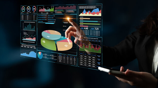 Business professional interacting with digital data visualization on a futuristic touchscreen interface for analysis and decision making in modern workspace Fluxor.