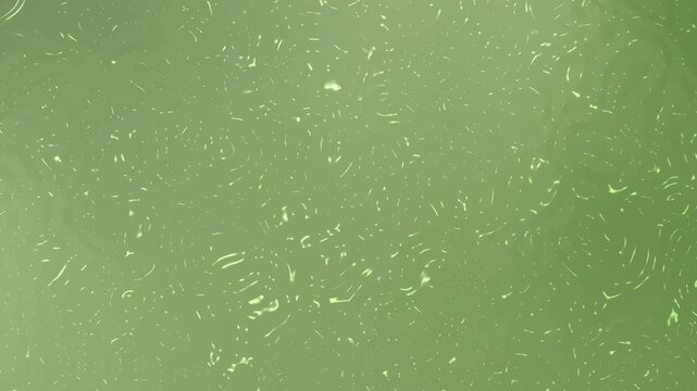 Abstract green textured background with soft organic patterns and subtle glowing details. Minimal artistic composition featuring fluid marks and atmospheric natural tones.