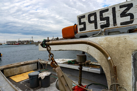 Edgartown, United States - 14 May 2026: View of the deck of a fishing boat at Martha's Vineyard with fishing gear and the harbor in the background.