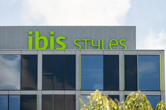 Sign of the ibis Styles hotel on top of a modern commercial building in Melbourne Australia.