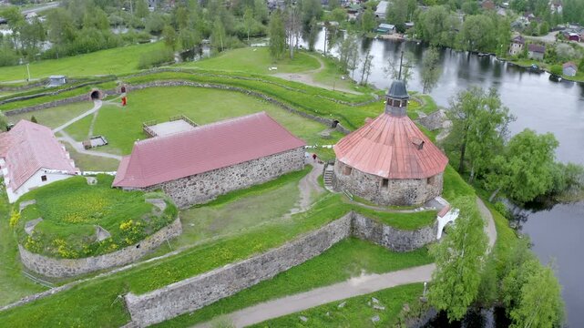 Tilt down aerial shot of Korela fortress on cloudy summer day. Priozersk, Leningrad Oblast, Russia.