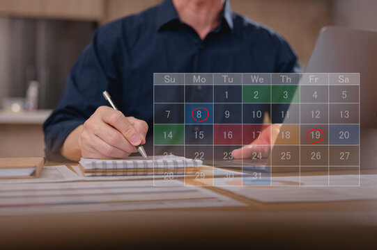 Business planning concept and Business people working writing on notebook and digital online calendar. Entrepreneurship and calendar schedule planning with filling course campaign.