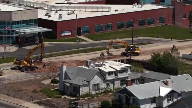 Zoom aerial of construction in Vernal Utah next to hospital