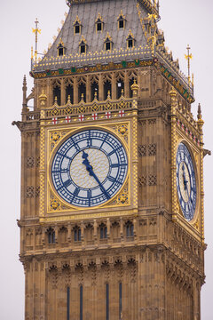 London, United Kingdom - 12 May 2025: View of the iconic Big Ben clock tower with its intricate gothic architecture and golden details against an overcast sky.