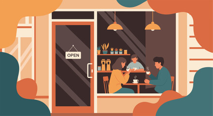 Fototapeta premium Friends or couple sitting at a table inside a warm and inviting coffee shop viewed through the storefront window with an open sign.