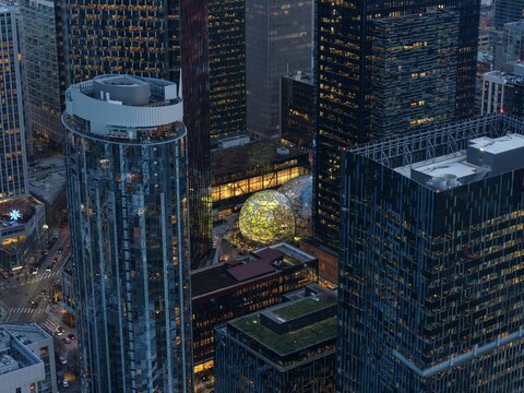 7th of February 2026 Drone flight above the Seattle downtown skyline with Amazon Spheres and modern office towers at blue hour, Washington USA. g.