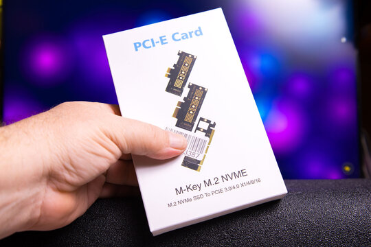 PCI-E M-Key M.2 NVMe SSD to PCIe 3.0 x4 adapter card shown in packaging with clear labeling. Product designed for connecting M.2 NVMe solid state drives to PCI Express slots for enhanced storage perfo