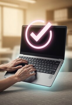 Glow digital checkmark symbol hovering over a person typing on a laptop keyboard in a workspace for document approval, compliance and automated business management