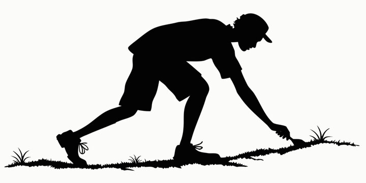 Silhouette of a man wearing a cap using a hand trowel for gardening with gardening silhouette gardener planting activity agriculture landscaping maintenance backyard cultivation equipment