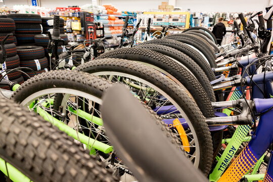 Lineup of Kettler bicycles displayed in a sporting goods store featuring models with knobby and smooth tires for various terrains. The image highlights the Kettler brand known for quality sporting bic