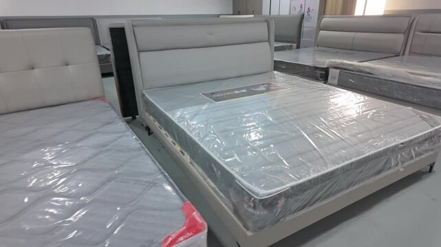 Multiple mattresses displayed in the exhibition hall