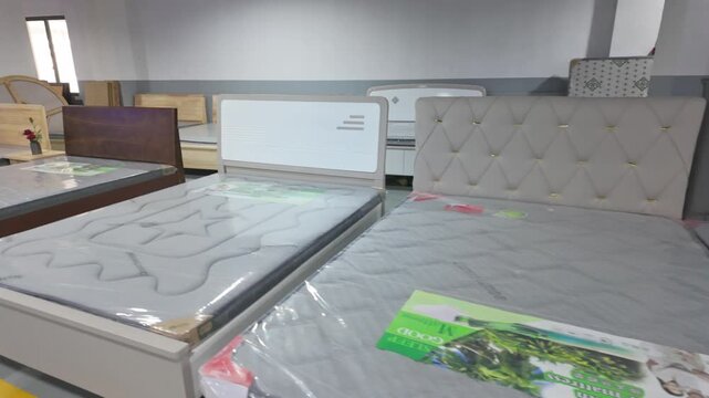 Indoor display of multiple mattresses and bed frames