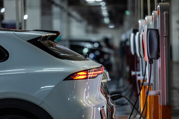 Autonomous EV car charging at AC power station. Self driving vehicle. © Nutchanart
