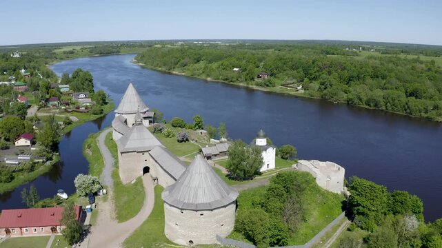 Aerial footage of Ladoga fortress and Volkhov river on sunny summer day. Staraya Ladoga, Leningrad Oblast, Russia.