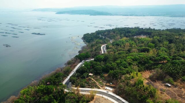 Aerial footage of fish ponds near Taal Volcano surrounded by tropical countryside at Talisay Laurel Batangas Philippines.